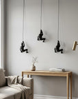 Set of Three Black Resin Climbing Man Hanging Dimensional Sculpture