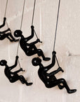Set of Four Black Resin Climbing Man Hanging Dimensional Sculpture