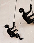 Set of Two Black Resin Climbing Man Hanging Dimensional Sculpture