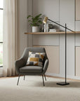 63" Black And Gold Adjustable LED Task Floor Lamp With Antiqued Brass Metal Cylinder Shade