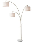 74" Brass Three Light Arc Floor Lamp With Off White Fabric Drum Shade