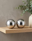 Set of Two Silver Buffed Aluminum Decorative Orb Tabletop Sculpture