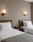 One Light Bronze and Glass Wall Sconce