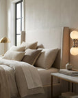 Two Light Silver Wall Sconce with Round Frosted Glass Shade