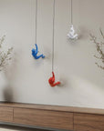 Set of Three Blue Red And White Resin Climbing Man Hanging Dimensional Sculpture