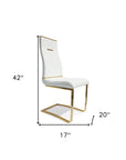 Set of Two White And Gold Faux Leather And Stainless Steel Dining Side Chairs