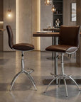 Set of Two Brown And Silver Faux Leather And Metal Low Back Adjustable Height Swivel Bar Chairs