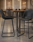Set of Two Black Faux Leather And Metal Low Back Counter Height Bar Chairs