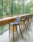 Set of Two 30" Dark Gray And Black Faux Leather And Fabric And Steel Bar Height Bar Chairs