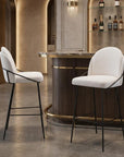 Set of Two 30" Ivory And Black Shearling And Fabric And Steel Bar Height Bar Chairs