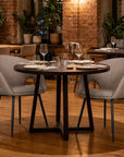 Set of Two Light Gray And Black Tufted Slipcovered Faux Leather And Wood Partially Open Back Dining Arm Chairs