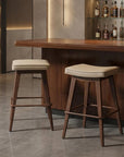 Set of Two 27" Beige And Walnut Faux Leather And Steel Backless Counter Height Bar Chairs