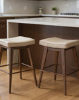Set of Two 27" Beige And Walnut Faux Leather And Steel Backless Counter Height Bar Chairs