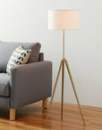 Gold Metal Adjustable Tripod Floor Lamp With White Linen Drum Shade