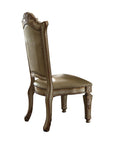 Set of Two Tufted Bone and Brass Upholstered Faux Leather And Wood Dining Side Chairs