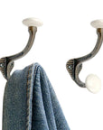 Set of Six Bronze And White Cast Iron And Ceramic Double Wall Hooks