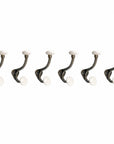 Set of Six Bronze And White Cast Iron And Ceramic Double Wall Hooks