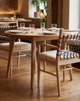 Set of Two Ivory And White Upholstered And Solid Wood Open Back Dining Arm Chairs