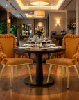 Set of Two Orange And Gold Velvet And Metal Dining Arm Chairs