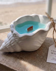 6" Light Blue Sea Salt And Orchid Scented Soy Wax Candle In White Resin Novelty Holder