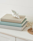 6" Light Blue Sea Salt And Orchid Scented Soy Wax Candle In White Resin Novelty Holder
