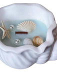 6" Light Blue Unscented Soy Wax Candle In White Resin Novelty Holder With Seashells