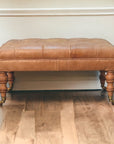 Buffalo Tan Leather Ottoman with Castor Legs
