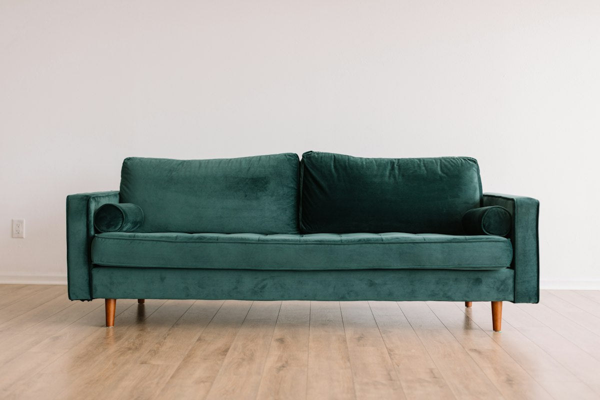 Stylish living room with pouf ottoman and neutral décor