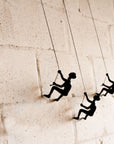 Set of Three Black Resin Climbing Man Hanging Dimensional Sculpture