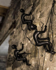 Set of Four Black Resin Climbing Man Hanging Dimensional Sculpture