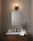 One Light Bronze Wall Light with Clear Glass Shade