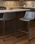 Set of Two 29" Charcoal And Black Faux Leather And Steel Counter Height Bar Chairs