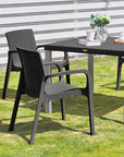 Set of Two Black Faux Rattan Heavy Duty Plastic Outdoor Stacking Arm Chairs