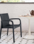 Set of Two Black Faux Rattan Heavy Duty Plastic Outdoor Stacking Arm Chairs