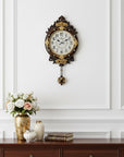 13" Brown Gold And White Resin Silent Pendulum Ornate Oval Wall Clock