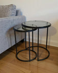 Set of Two Clear and Gunmetal Glass and Iron Round Frame Nested Tables