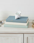 6" Light Blue Sea Salt And Orchid Scented Soy Wax Candle In White Resin Novelty Holder