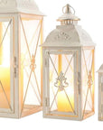 Set of Three White And Clear Filigree Scroll Metal And Glass Tabletop Lantern Candle Holders