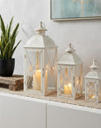 Set of Three White And Clear Filigree Scroll Metal And Glass Tabletop Lantern Candle Holders