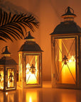 Set of Three White And Clear Filigree Scroll Metal And Glass Tabletop Lantern Candle Holders