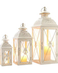 Set of Three White And Clear Filigree Scroll Metal And Glass Tabletop Lantern Candle Holders