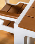 Set of Four Brown And White Faux Wood Heavy Duty Plastic Outdoor Stacking Arm Chairs