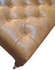 Buffalo Tan Leather Ottoman with Castor Legs
